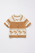 Children's brown and beige striped shirt with palm tree design on a white background