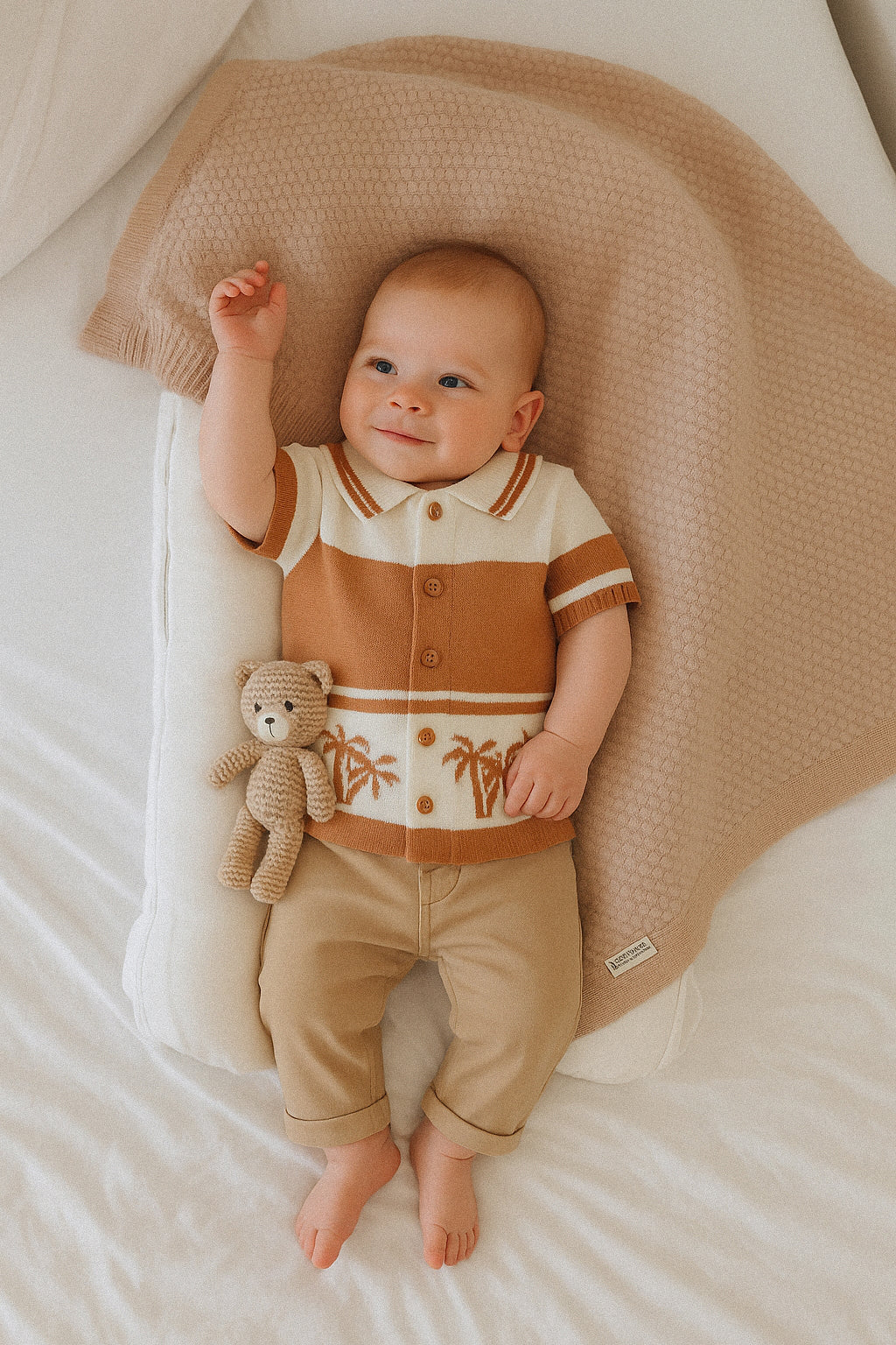 Children's brown and beige striped shirt with palm tree design on a white background
