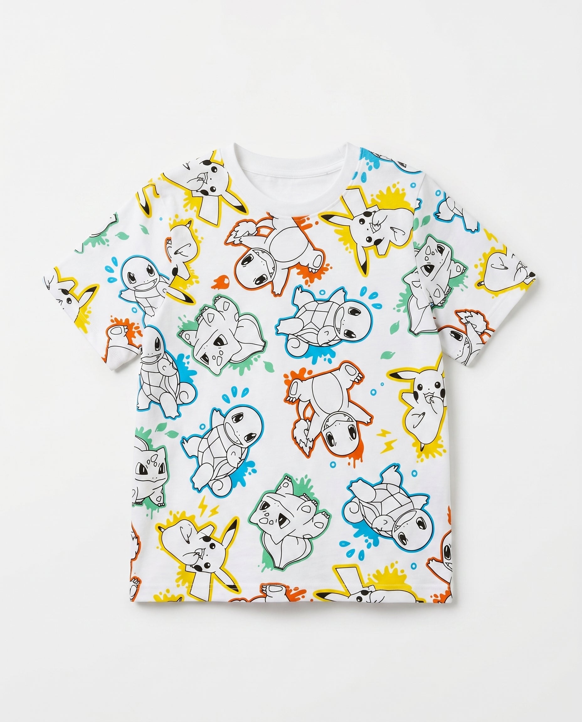 Flat lay of a boys' white short-sleeve t-shirt with a fun all-over repeat print of Pokémon characters including Pikachu, Charmander, Squirtle, and Bulbasaur in comic line-art style with multicolour ink-splash accents