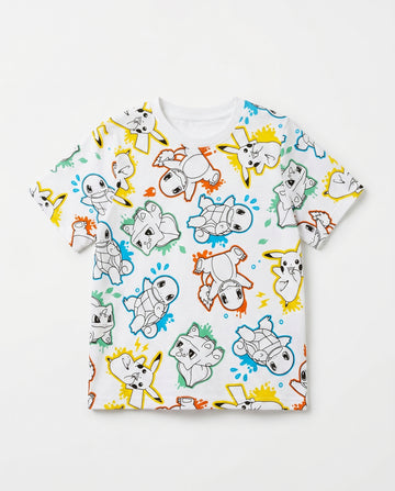 Flat lay of a boys' white short-sleeve t-shirt with a fun all-over repeat print of Pokémon characters including Pikachu, Charmander, Squirtle, and Bulbasaur in comic line-art style with multicolour ink-splash accents