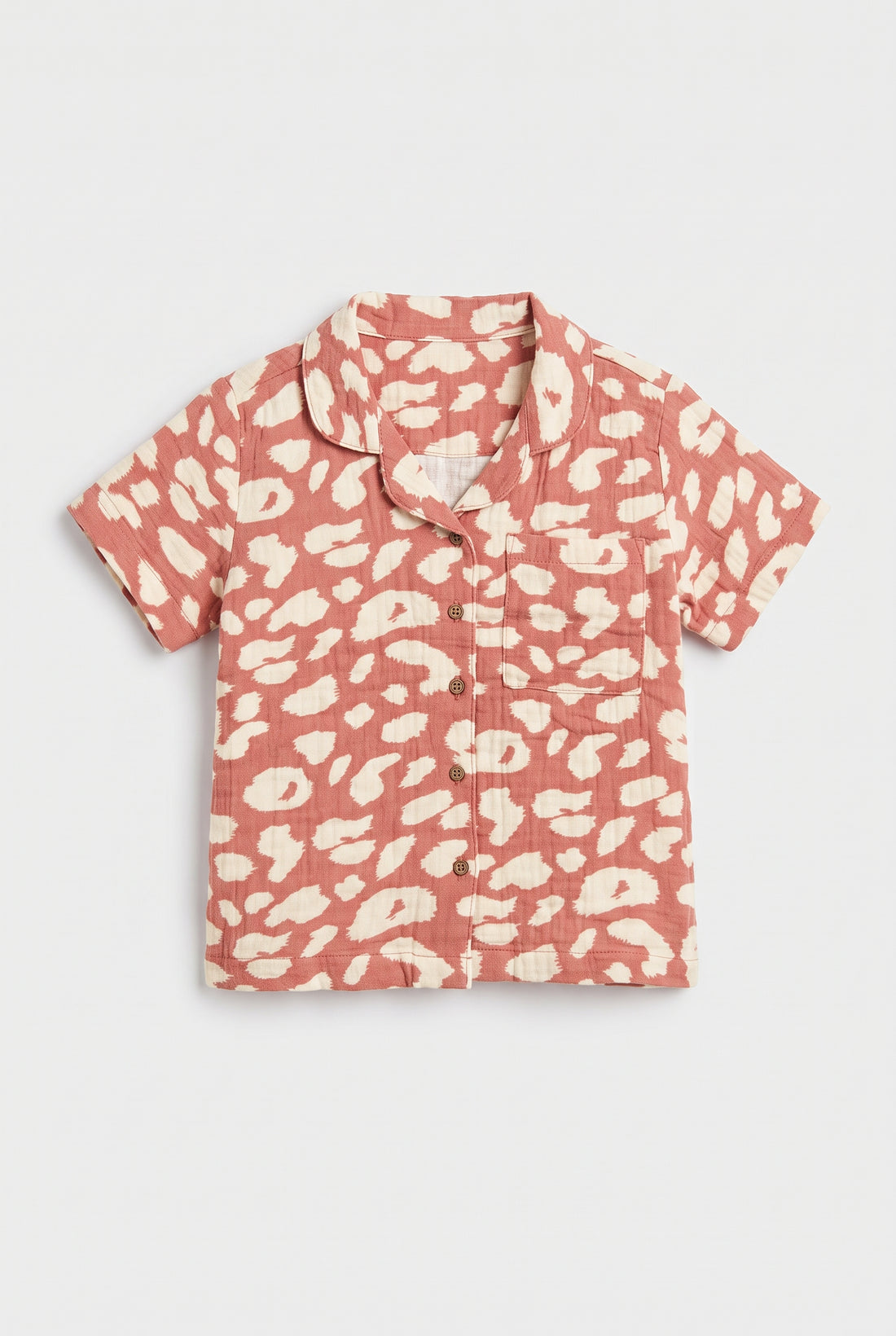 Coral pink kids short sleeve shirt with cream animal print, camp collar, button front and chest pocket