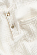 PTex Fashion off-white muslin shirt, close-up of button placket and chest pocket