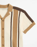 Knitted cardigan with brown and beige stripes on a white background