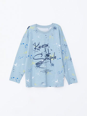 Light blue long-sleeve shirt with text and abstract patterns on a white background