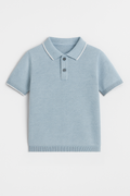 Light blue polo shirt with white collar on a light gray background