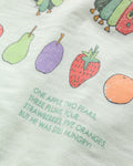 Detail of colourful fruit illustration and storybook text print on back of baby romper