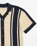 Navy and beige striped cardigan with button details on a white background