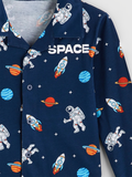 Navy blue shirt with space-themed print including astronauts, rockets, and planets on a white background.