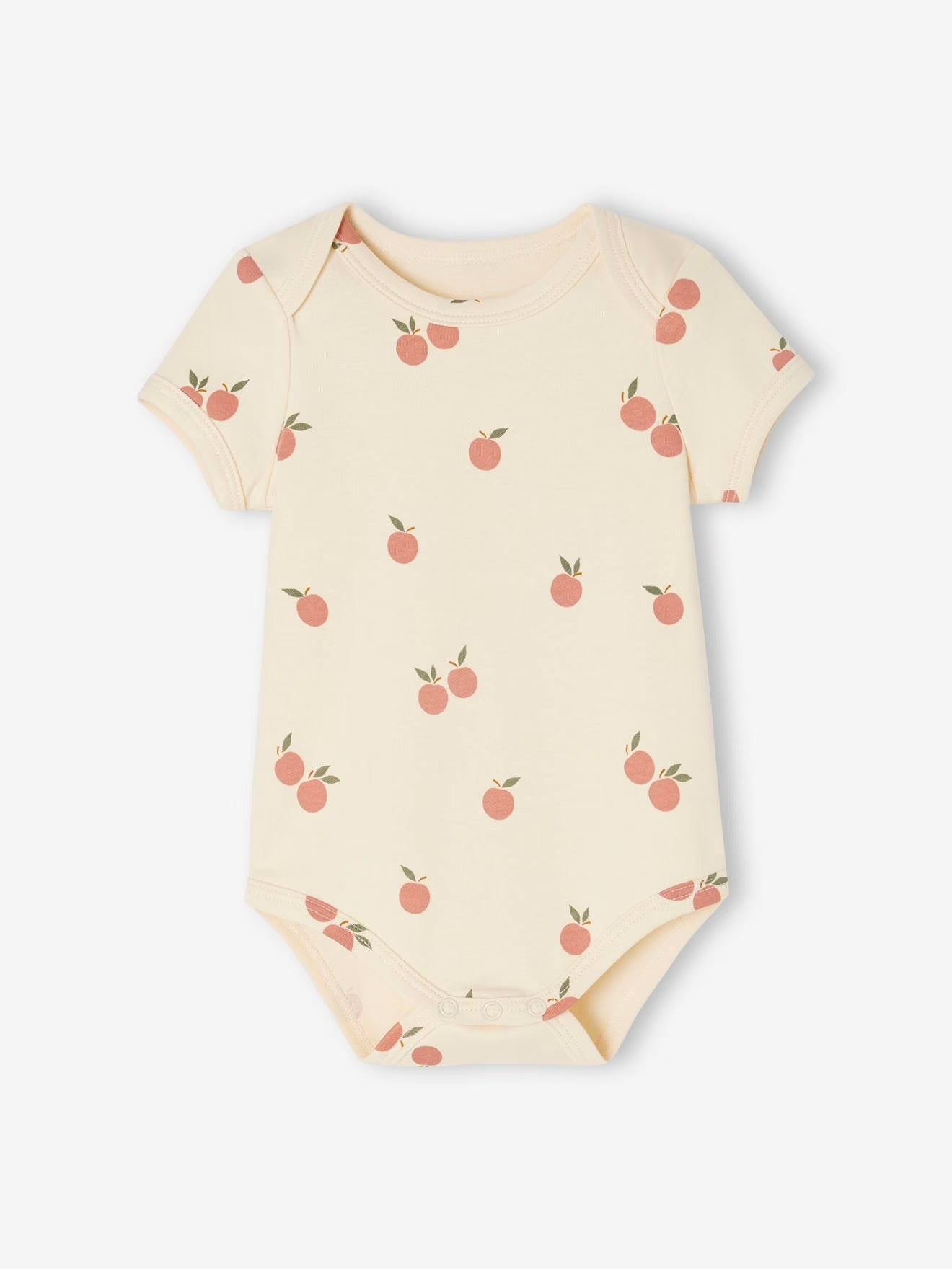Baby onesie with peach pattern on a white background