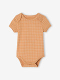 Orange grid-patterned baby bodysuit on a white background