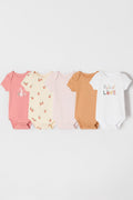 Five baby bodysuits in various colors and patterns on a white background