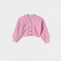 Pink knitted cardigan with button details on a light gray background