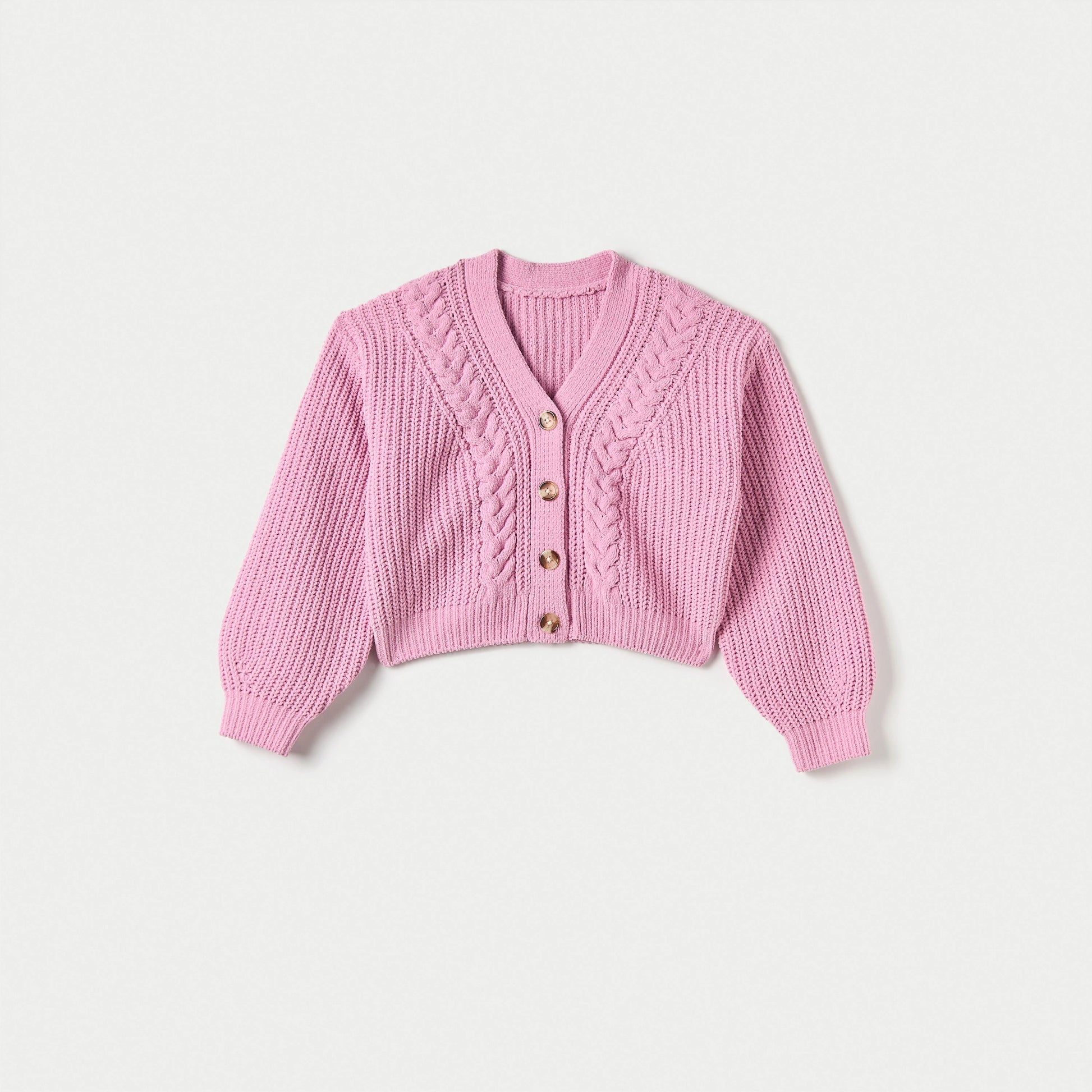 Pink knitted cardigan with button details on a light gray background