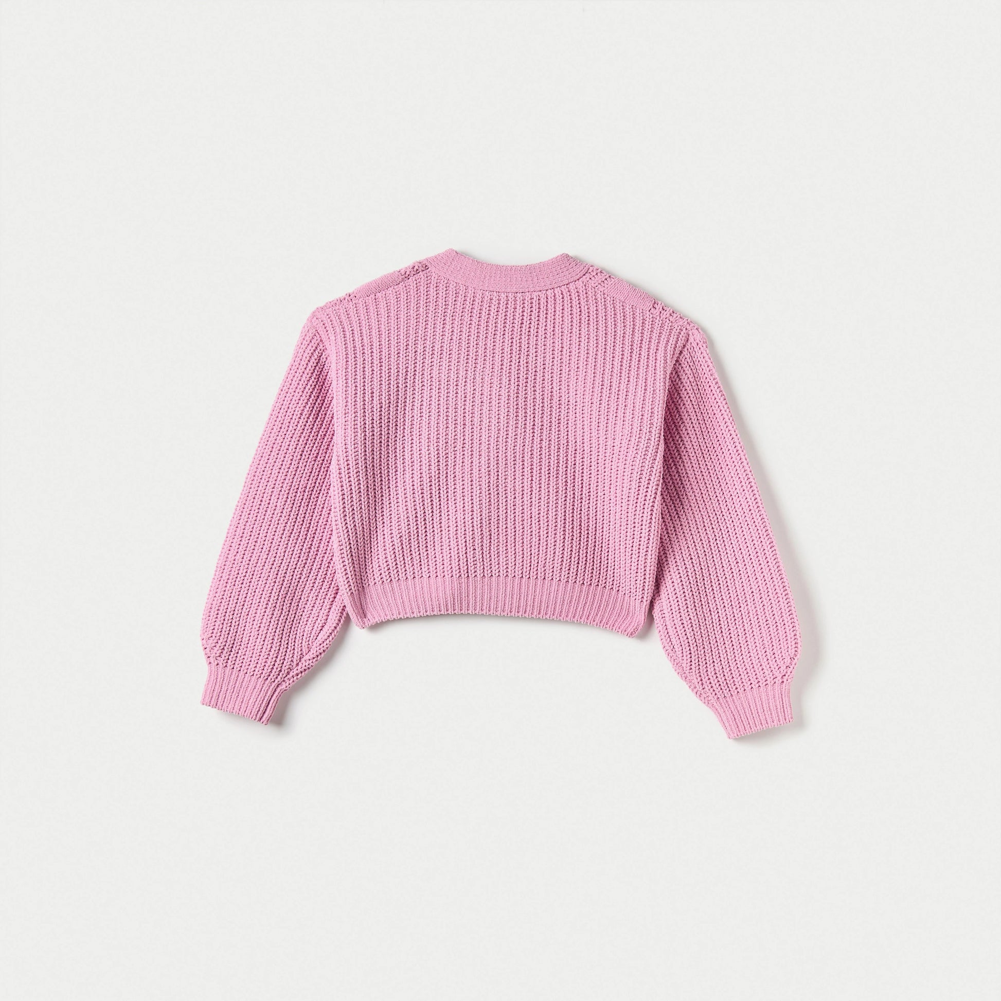 Pink knitted sweater on a light gray background