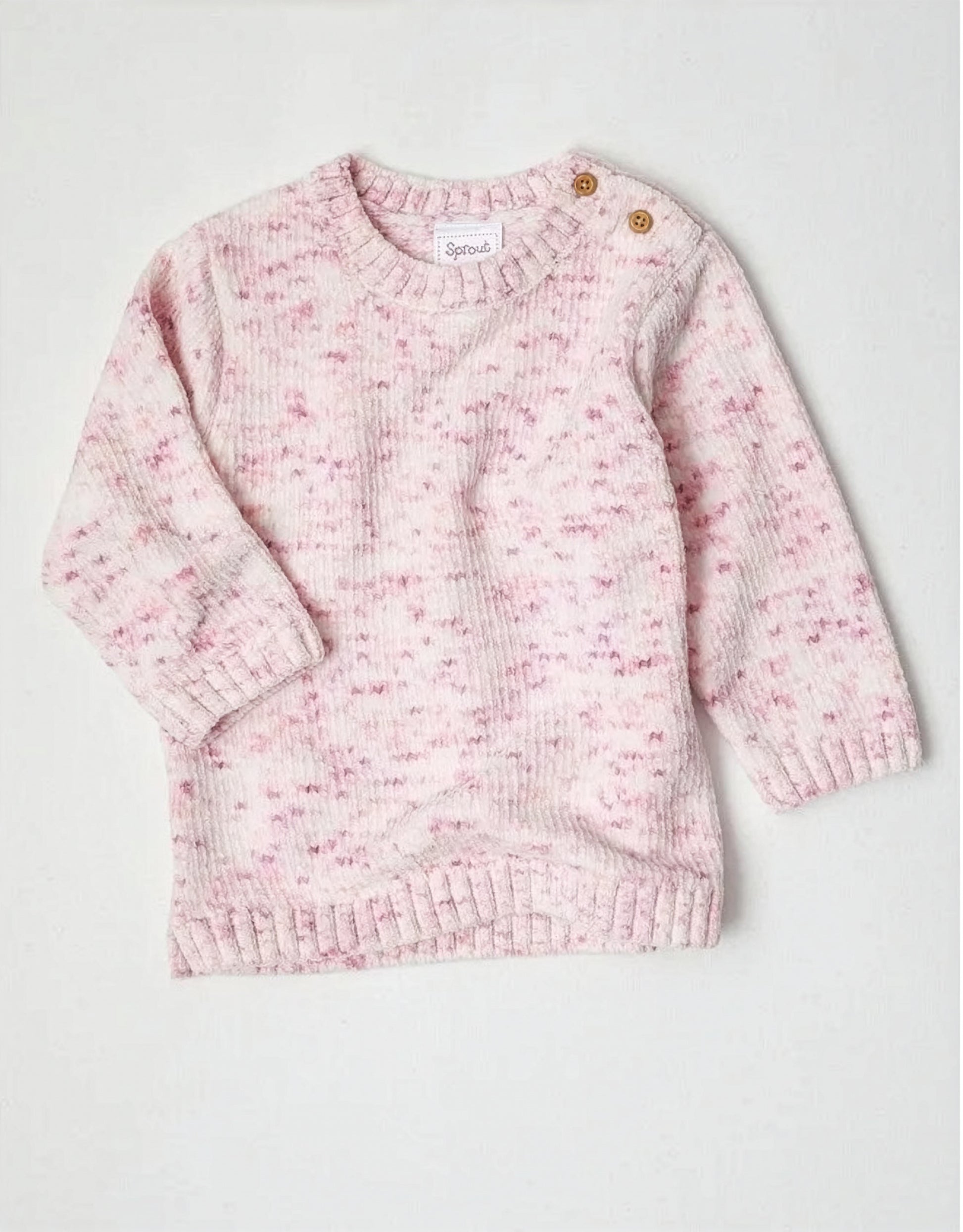 Pink knitted sweater on a white background