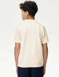 Child wearing a beige short-sleeve shirt with lace details on a white background