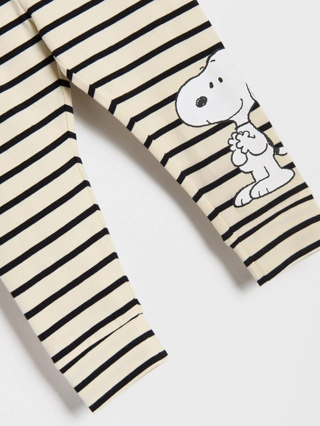 Striped leggings with a cartoon character on a white background