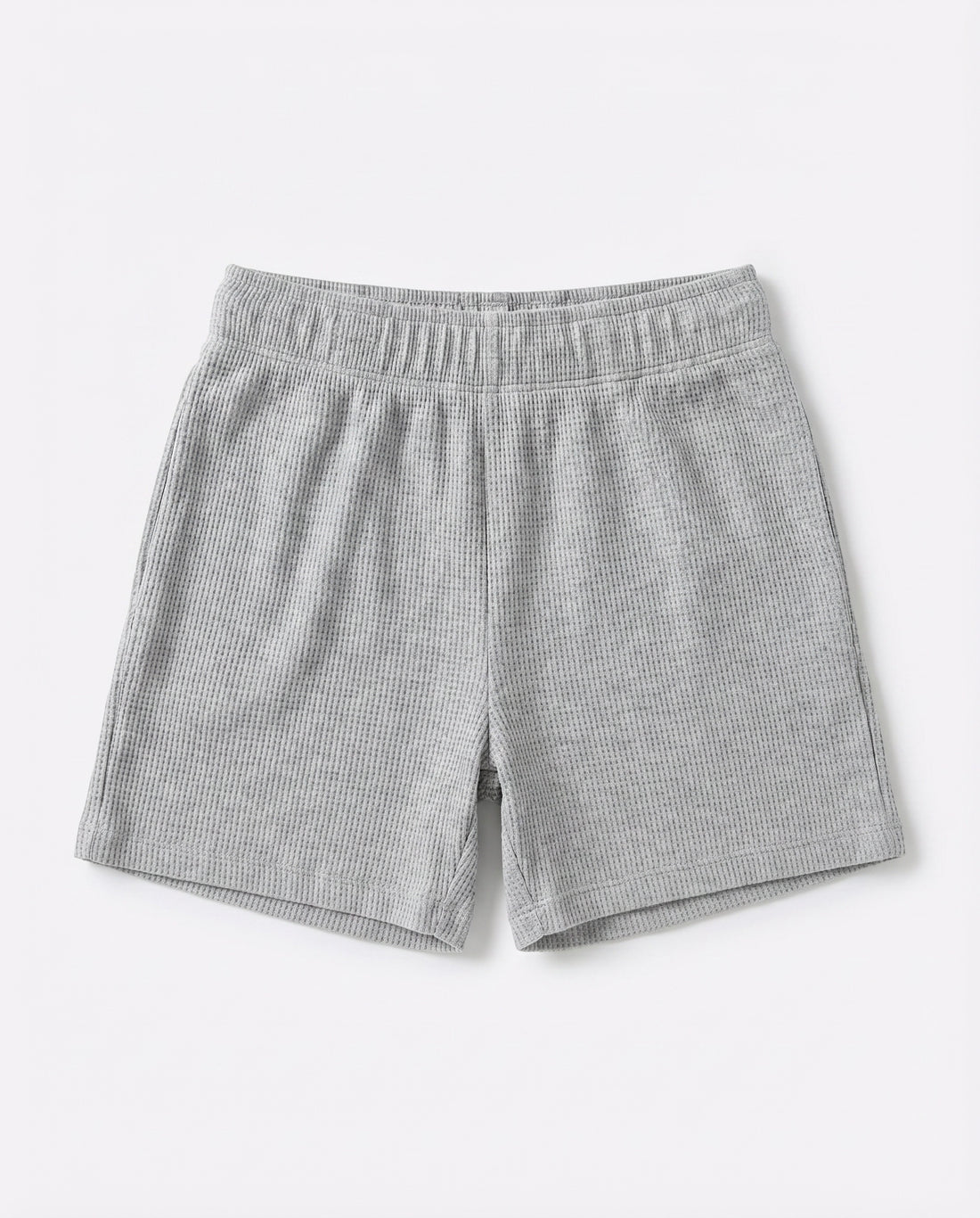Full front flat-lay view of toddler waffle cotton short pants in light grey with elasticated waistband and relaxed short-length silhouette on white background.
