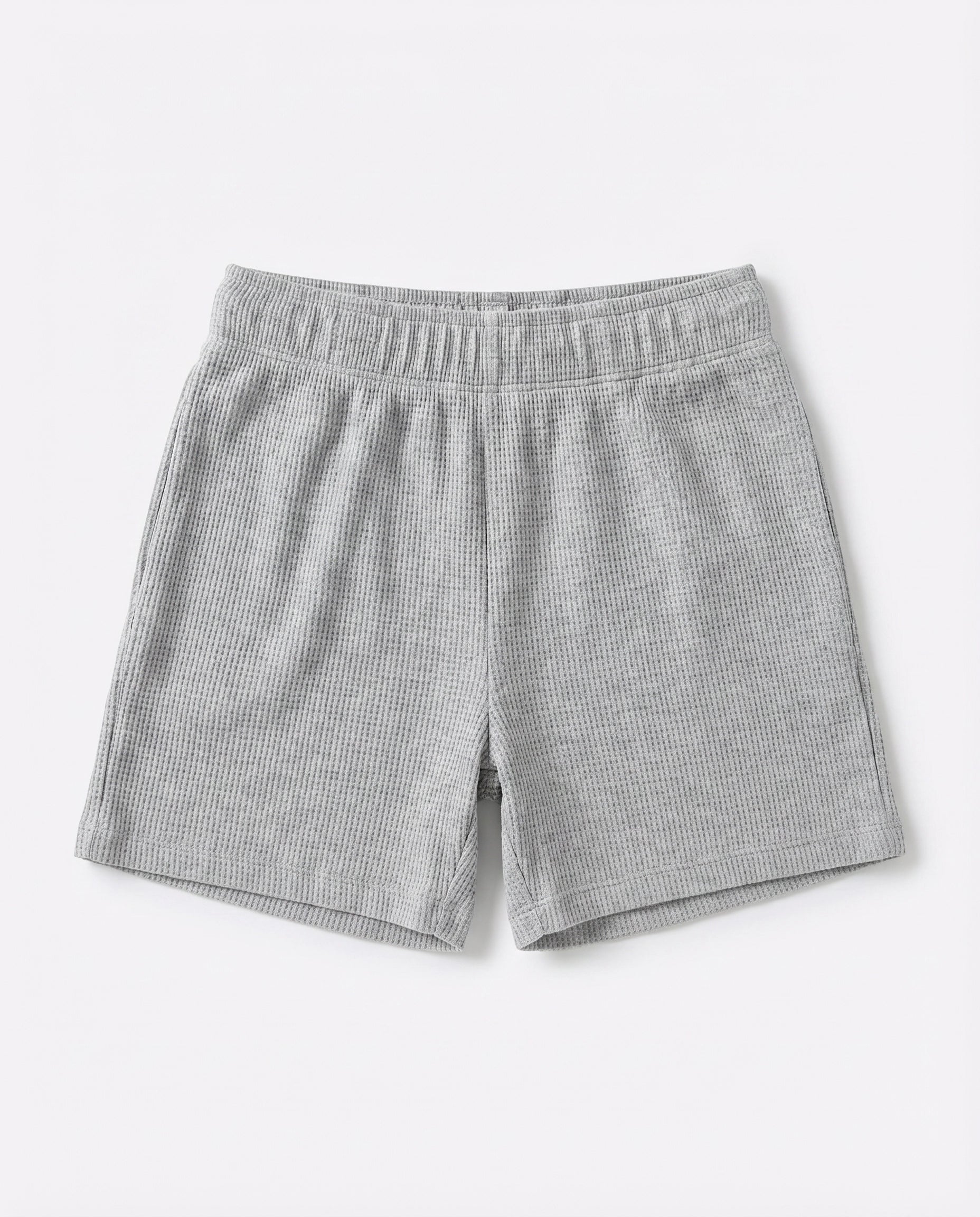 Full front flat-lay view of toddler waffle cotton short pants in light grey with elasticated waistband and relaxed short-length silhouette on white background.