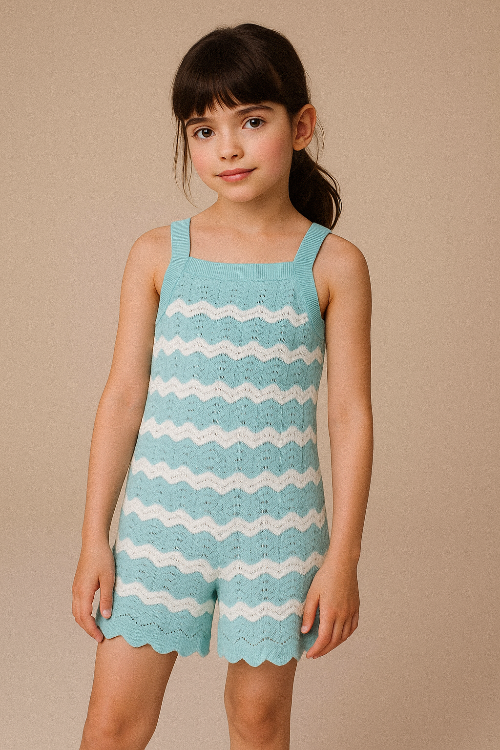 Young girl wearing a blue and white striped dress against a beige background