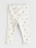 White baby leggings with tulip pattern on a white background