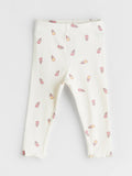 White leggings with small colorful patterns on a light gray background