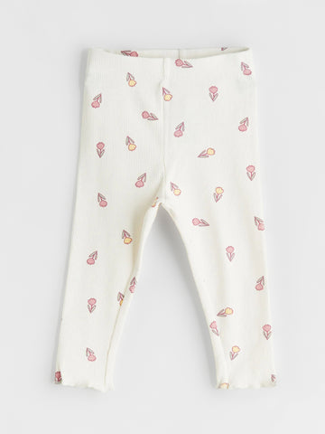 White leggings with small colorful patterns on a light gray background