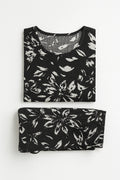 Black and white floral-patterned top and bottom set on a white background