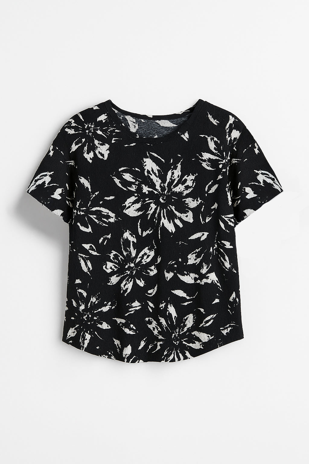 Black t-shirt with white floral pattern on a white background