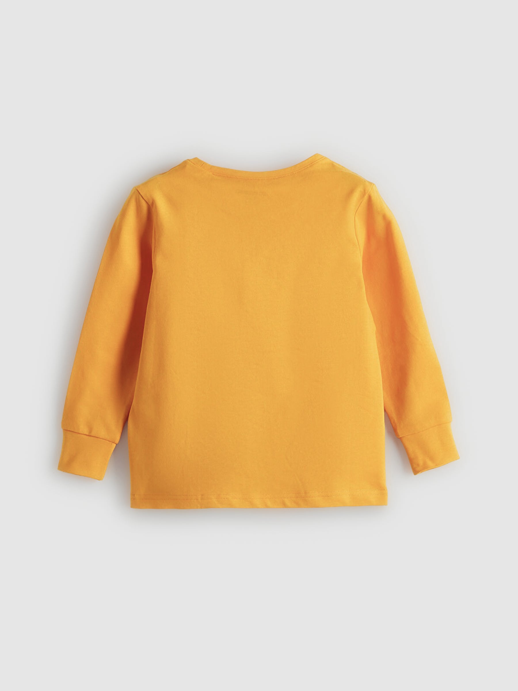 Yellow long-sleeve shirt on a light gray background