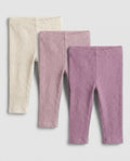 Baby girls' cable-knit leggings 3-pack in cream, blush pink, and mauve purple, flat lay on grey background