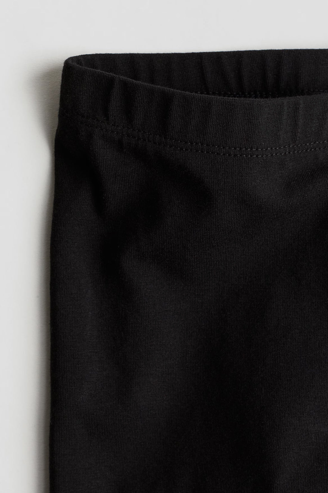 Baby girls solid black leggings with elasticated waistband and full-length fitted legs