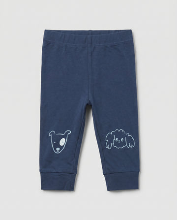PTex Fashion navy blue baby knit jogger pants with cute hand-drawn animal face prints on the knees and ribbed cuffed ankles, laid flat on a light grey background
