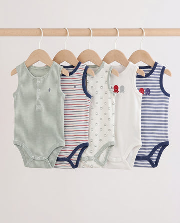 Five baby sleeveless bodysuits in mixed stripe and print designs hanging on wooden hangers — sage stripe, red multi-stripe, cream print, white octopus graphic, and blue stripe