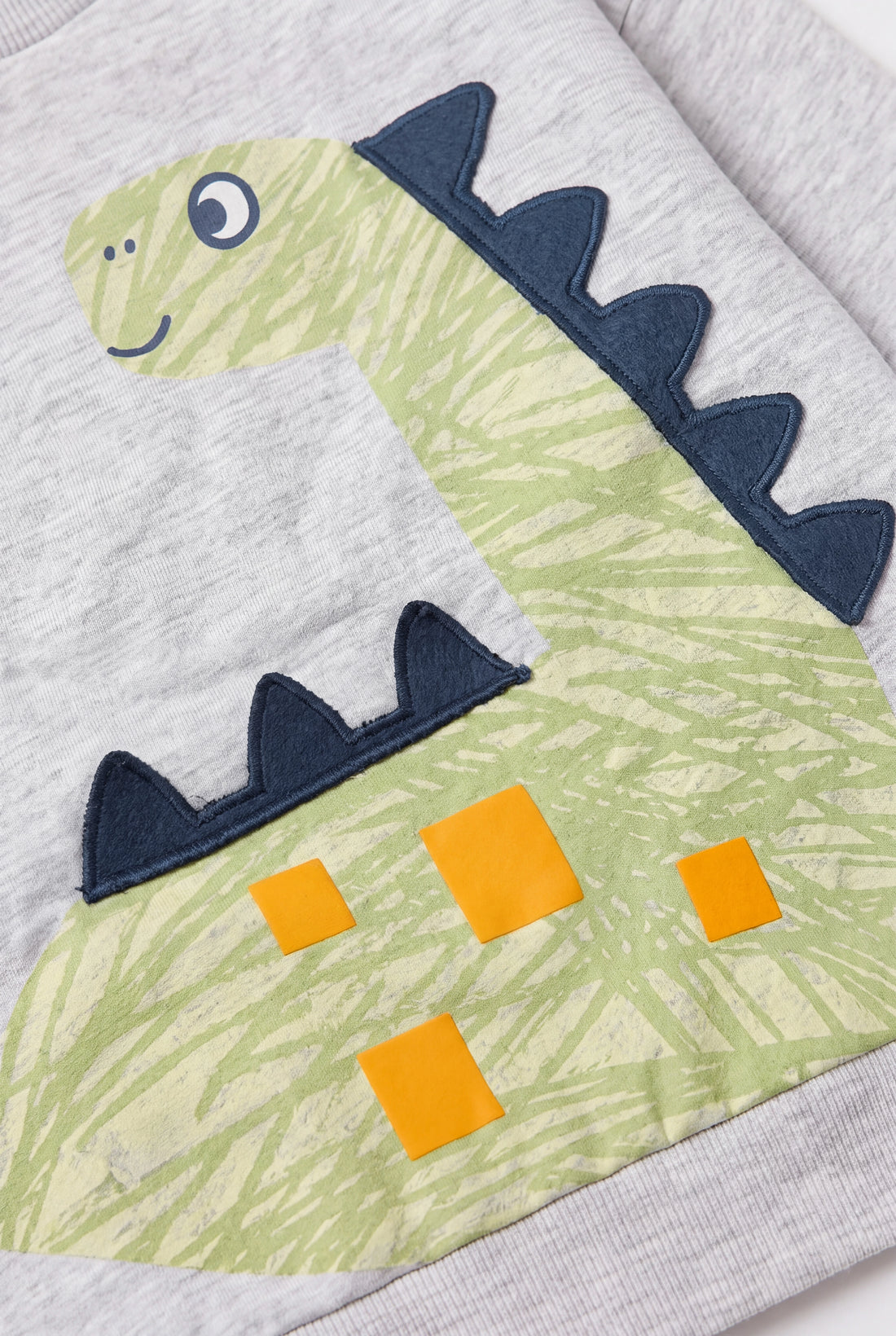 PTex Fashion baby boy grey marl crew-neck sweatshirt with green dinosaur appliqué print, flat-lay front view