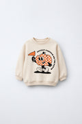 PTex Fashion cream relaxed-fit kids’ sweatshirt with pumpkin graphic, front flat lay