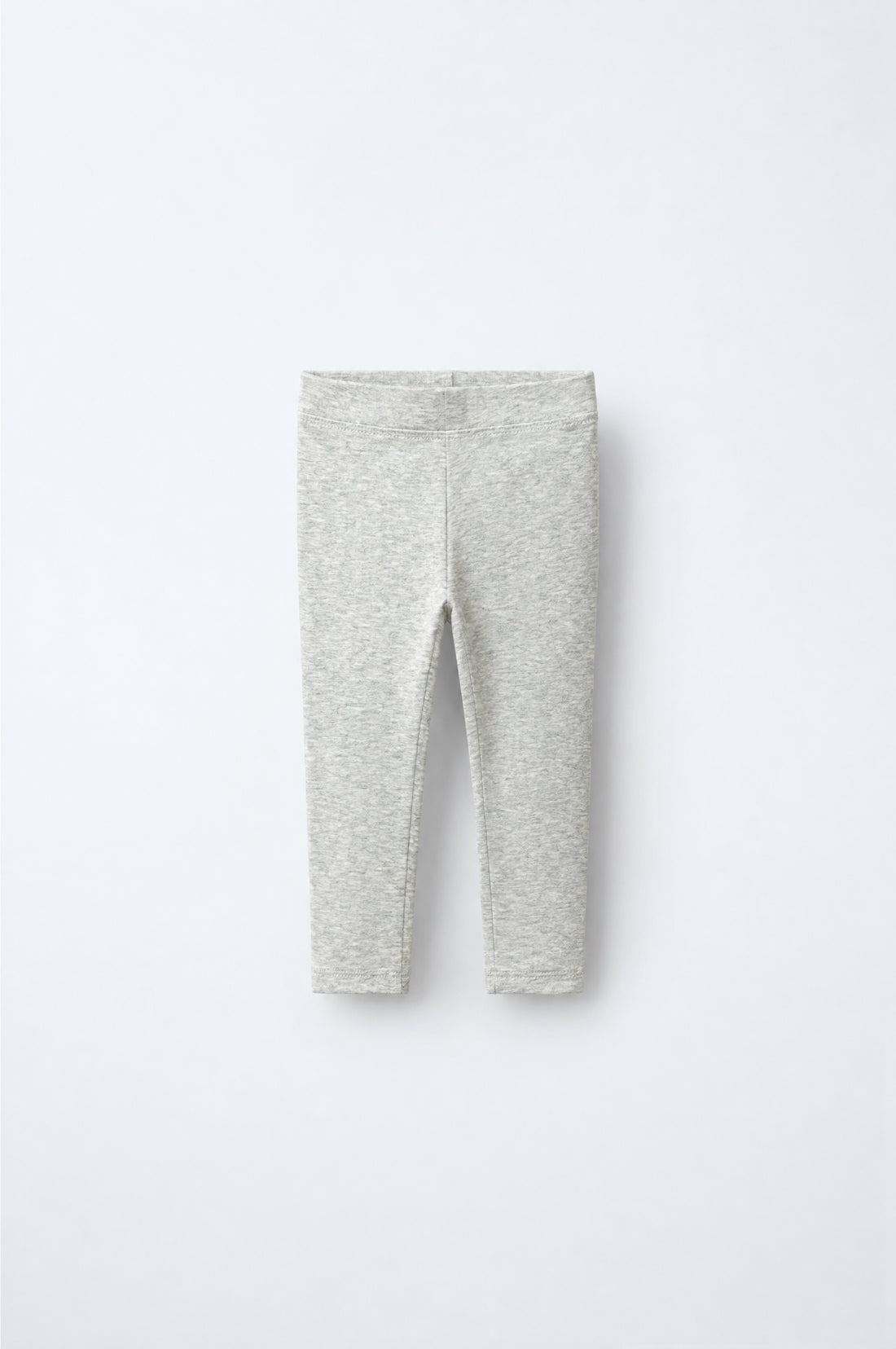Baby girl light marl grey leggings with subtle heathered texture, elasticated waistband and neatly stitched leg hems.