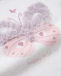 Close-up of pink glitter butterfly with raised ruffle wings and happy to be me text on white tee
