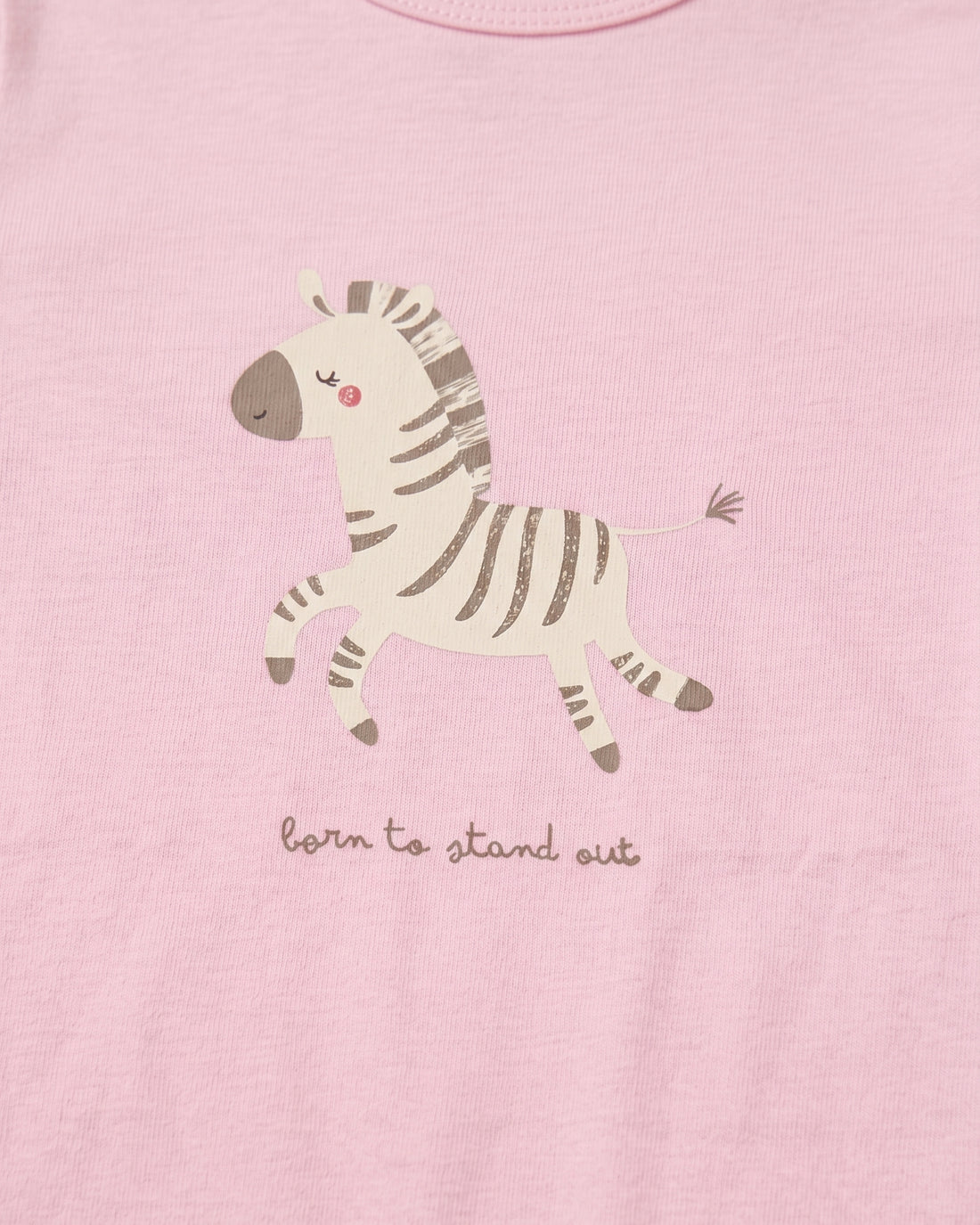 Blush pink baby girl romper with zebra graphic print, "born to stand out" slogan, and frill sleeves, flat lay on white background