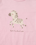 Close-up of blush pink baby romper chest area showing cute illustrated zebra print and 