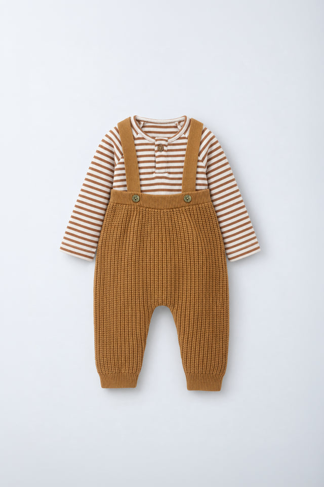 PTex Fashion baby caramel chunky knit dungaree with cream and caramel striped ribbed cotton henley bodysuit, flat lay