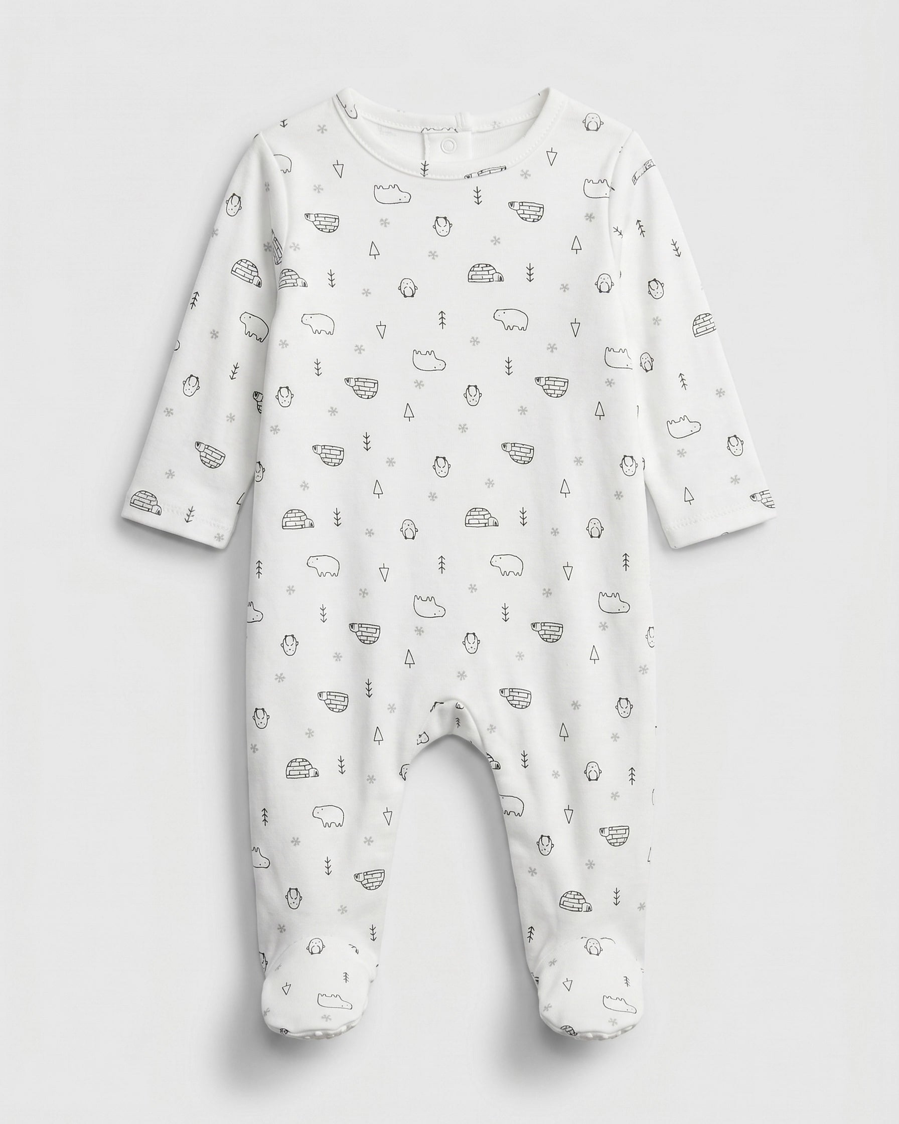 PTex Fashion off-white baby footed romper with allover arctic polar bear, penguin and igloo print, flat lay