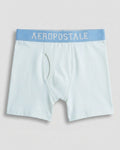 Boys' premium cotton boxer brief in soft powder blue with sky-blue logo waistband, flat lay front view