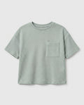 Boy's sage mint waffle cotton t-shirt with relaxed boxy fit, ribbed crewneck, and patch chest pocket, photographed flat on a soft grey backdrop.