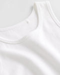 Close-up of soft ribbed cotton fabric and neckline stitching on PTex Fashion boys' white school undershirt vests