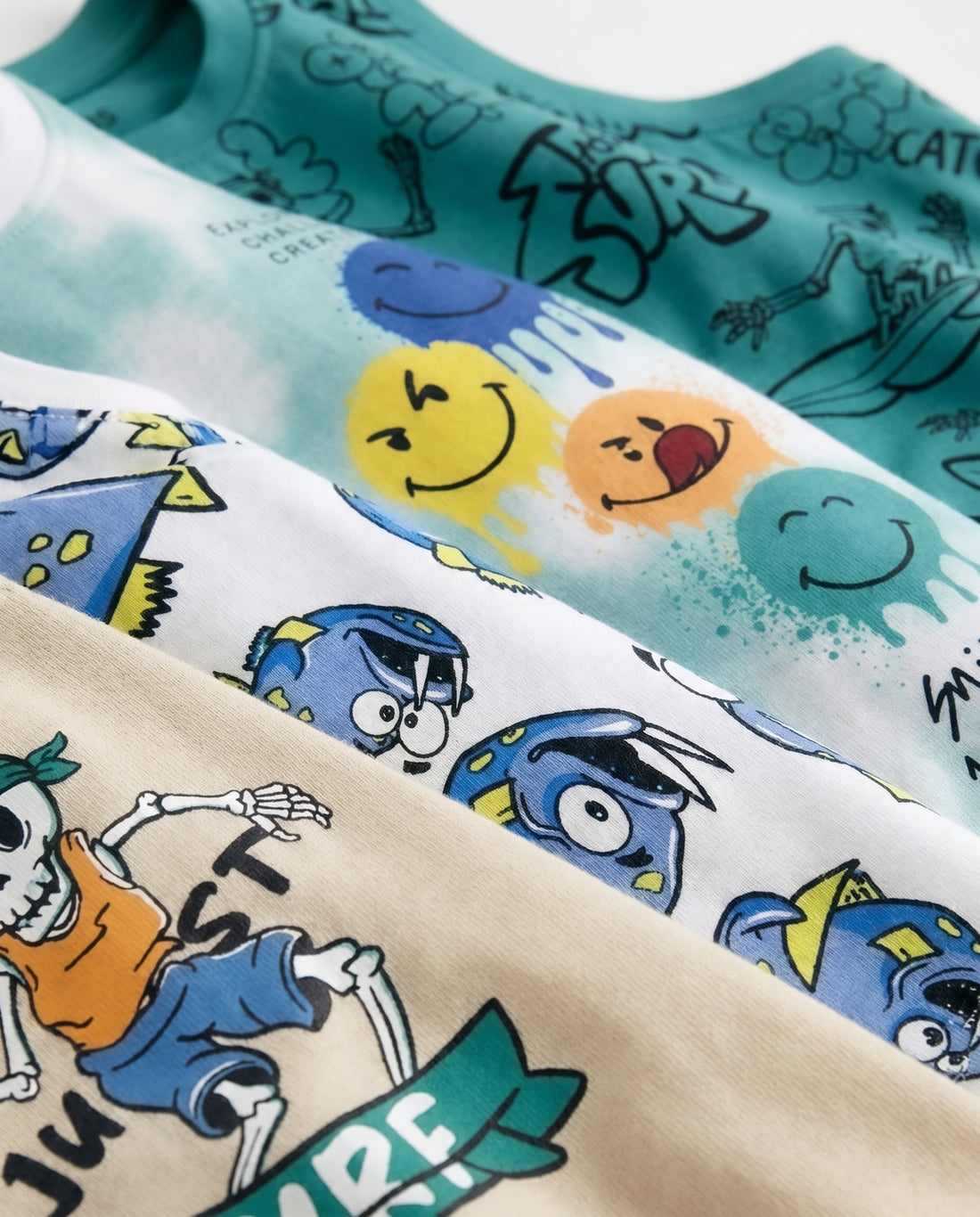 close look macro image of 4 pieces boy cotton tank tops