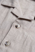 Boys beige linen blend short sleeve button-up shirt with camp collar and natural woven texture