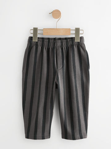 PTex Fashion charcoal and grey striped kids' trousers on a wooden hanger