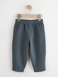 Slate blue fleece joggers with elastic waist and side pockets on a wooden hanger - PTex Fashion