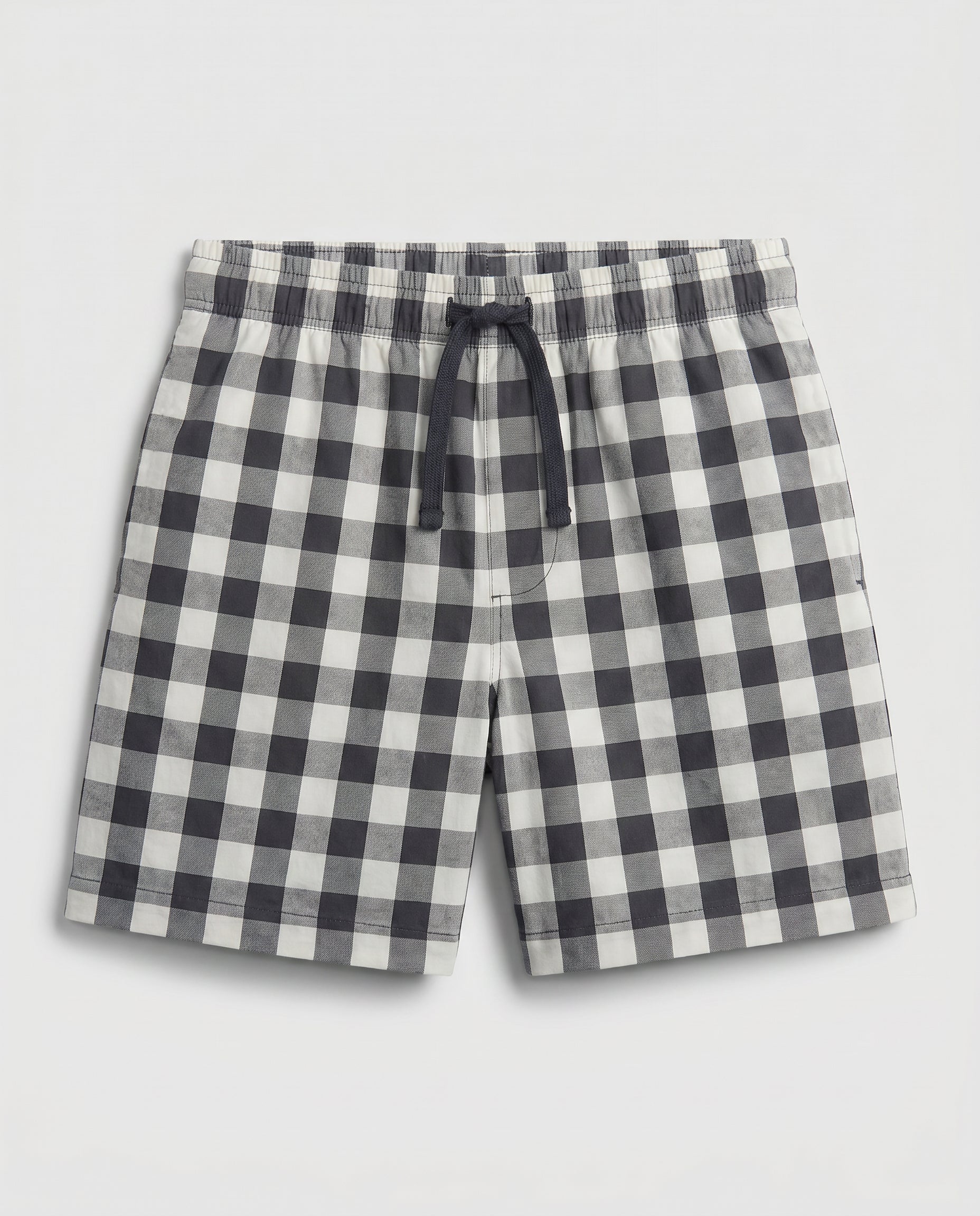 Boys' woven cotton pull-on short pant in navy and off-white block check with adjustable drawstring waist, flat lay product photo